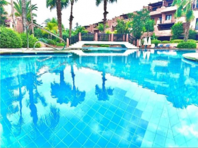Bel appart avec jardin, terrasse et piscine lagon